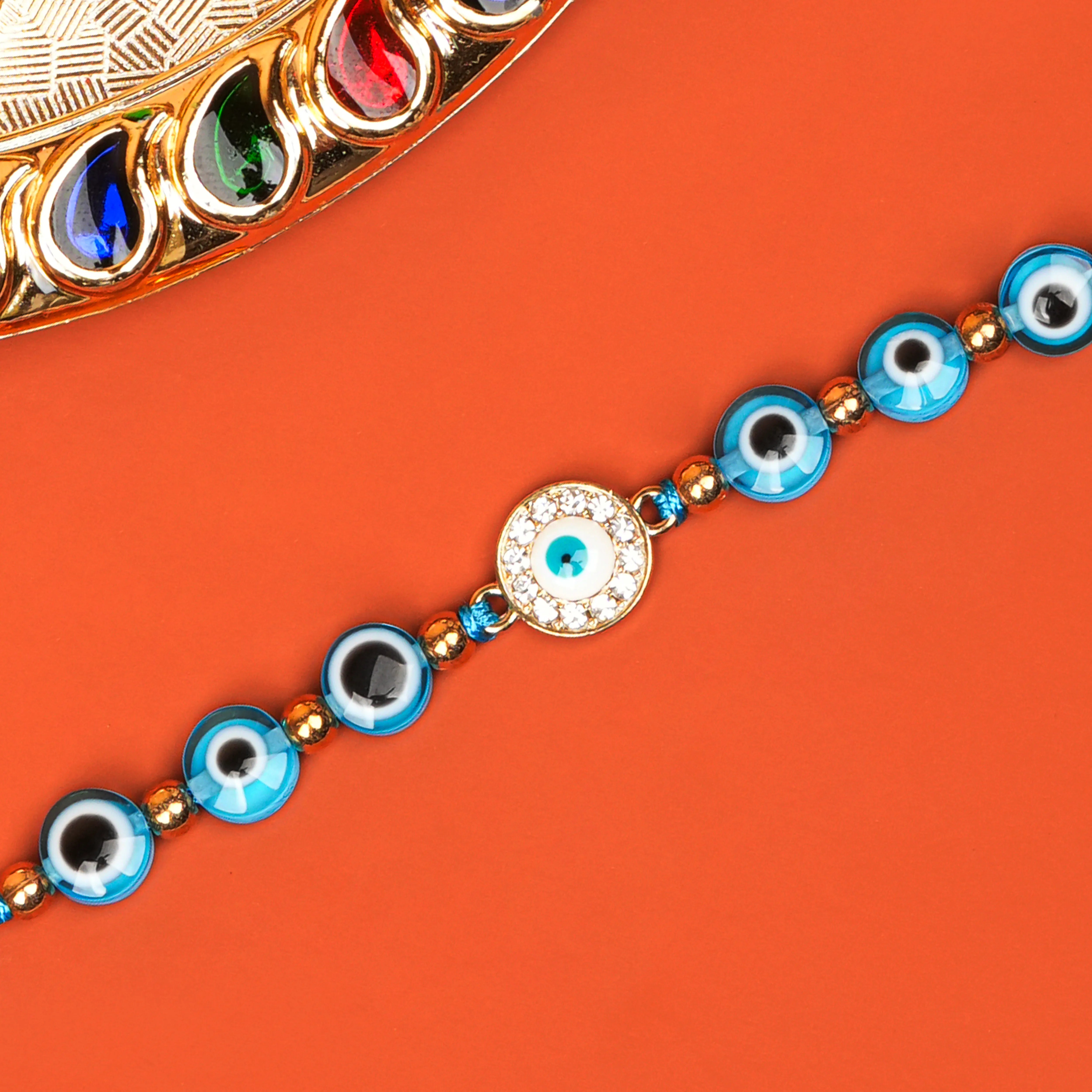 Handcrafted Drishti Kavach Studded Rakhi With Roli Chawal Thali