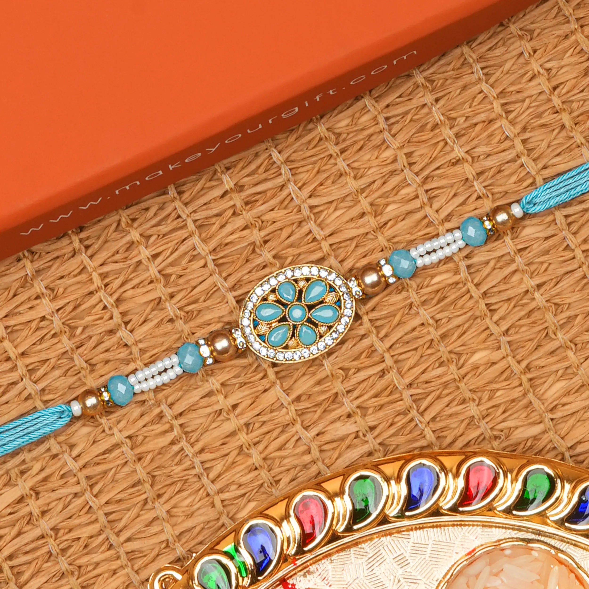 Handcrafted Shubh Neel Pushp Beads Rakhi With Roli Chawal Thali