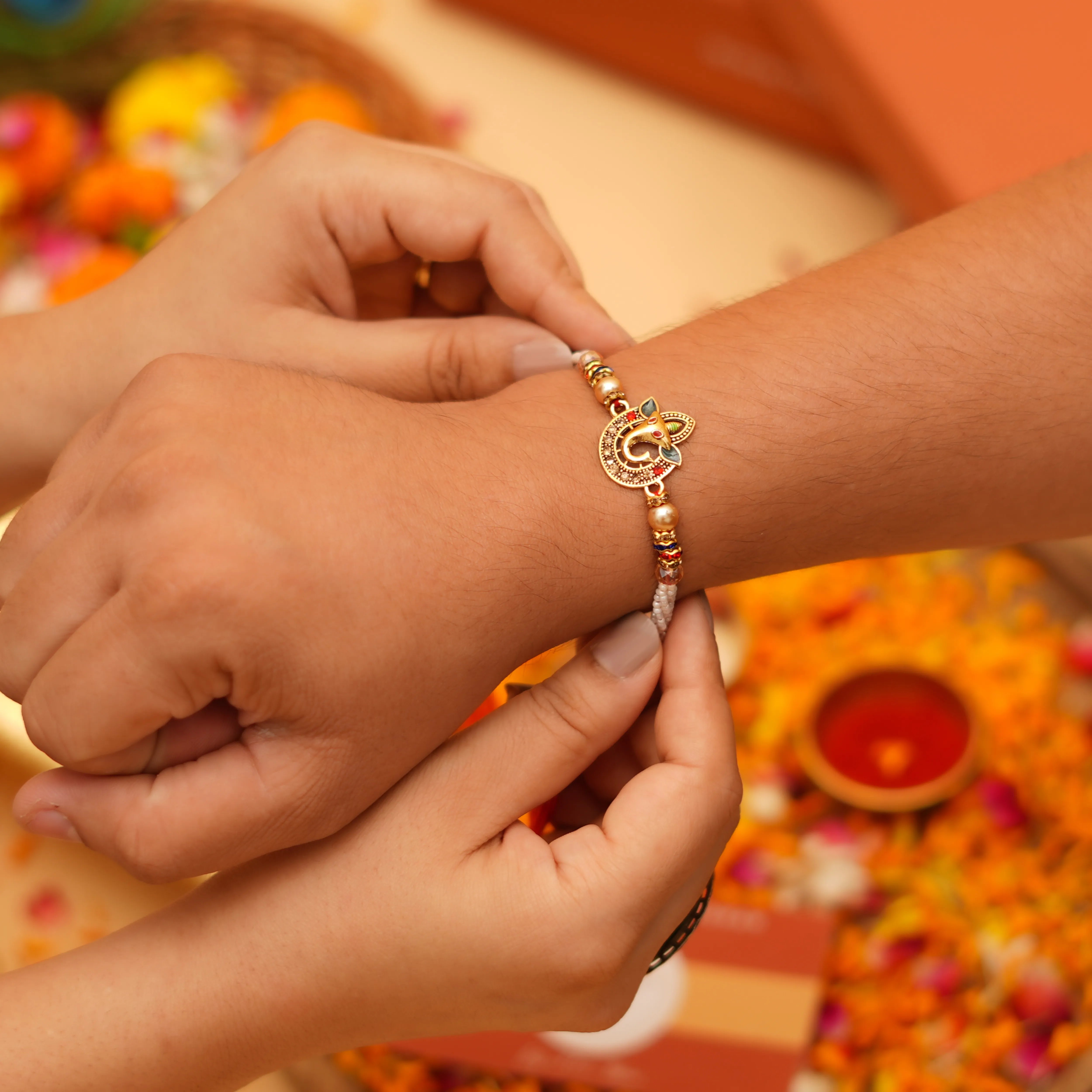 Handcrafted Sri Ganesh Pearl Bead Rakhi With Roli Chawal Thali