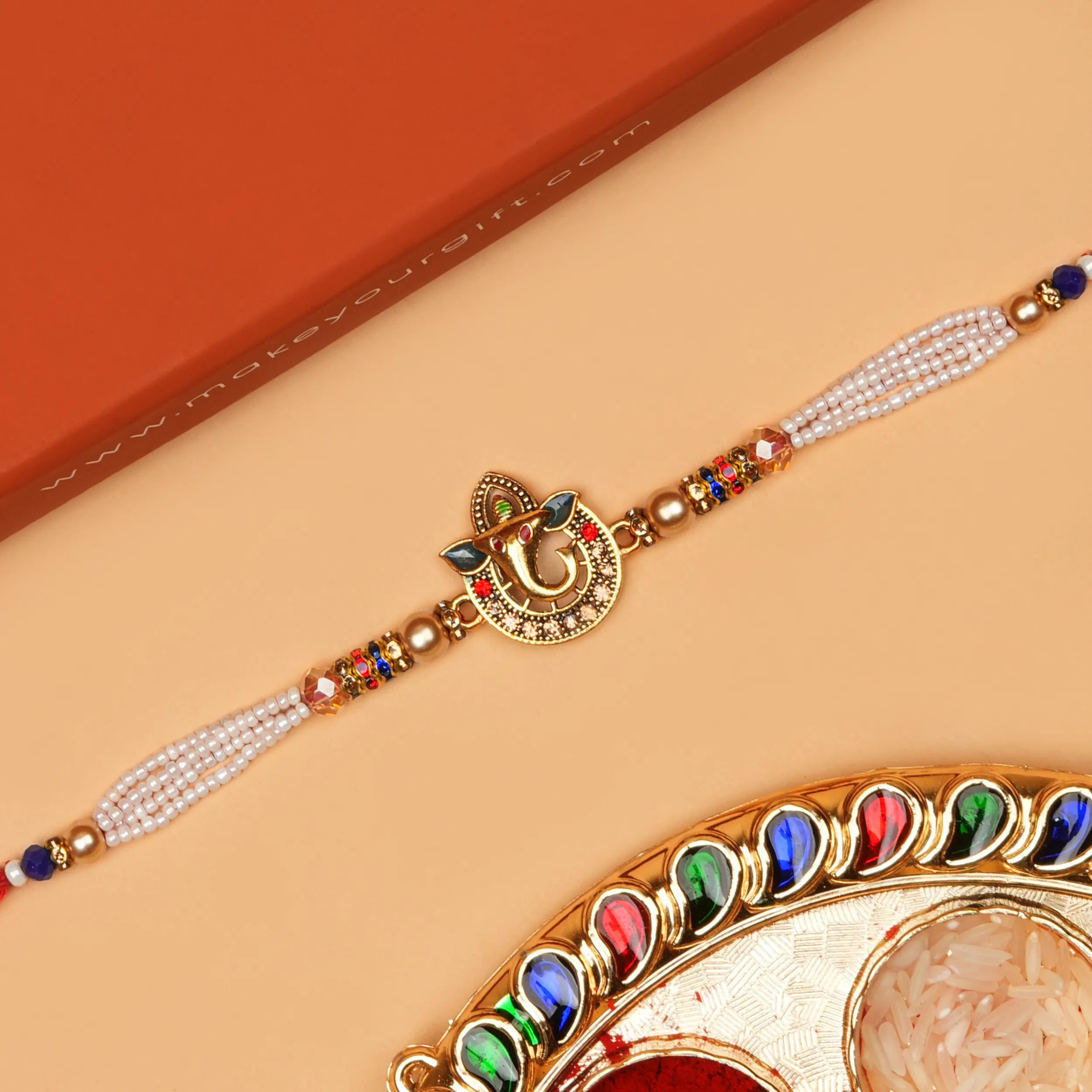 Handcrafted Sri Ganesh Pearl Bead Rakhi With Roli Chawal Thali