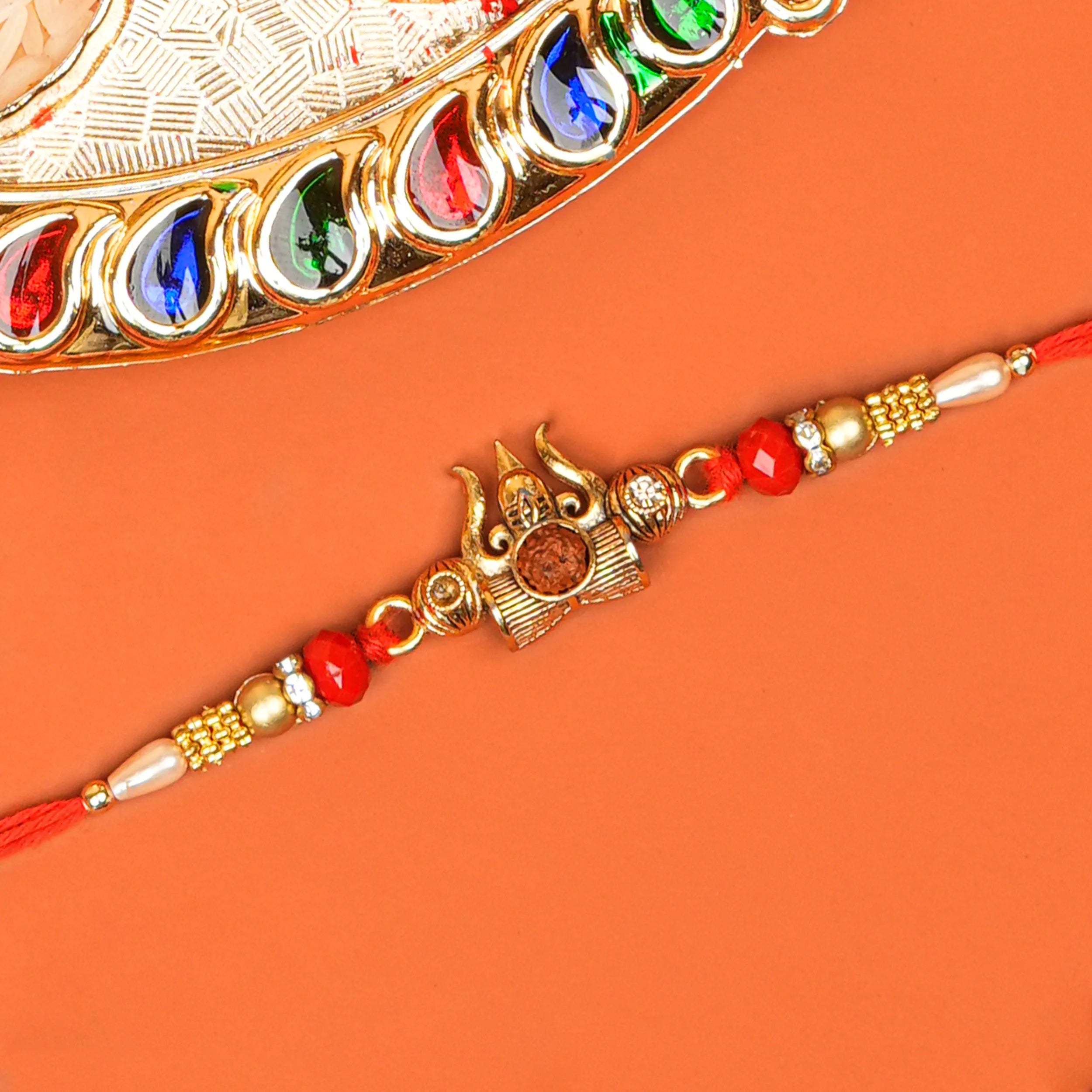 Handcrafted Trishul With Rudraksh Beads Rakhi With Roli Chawal Thali
