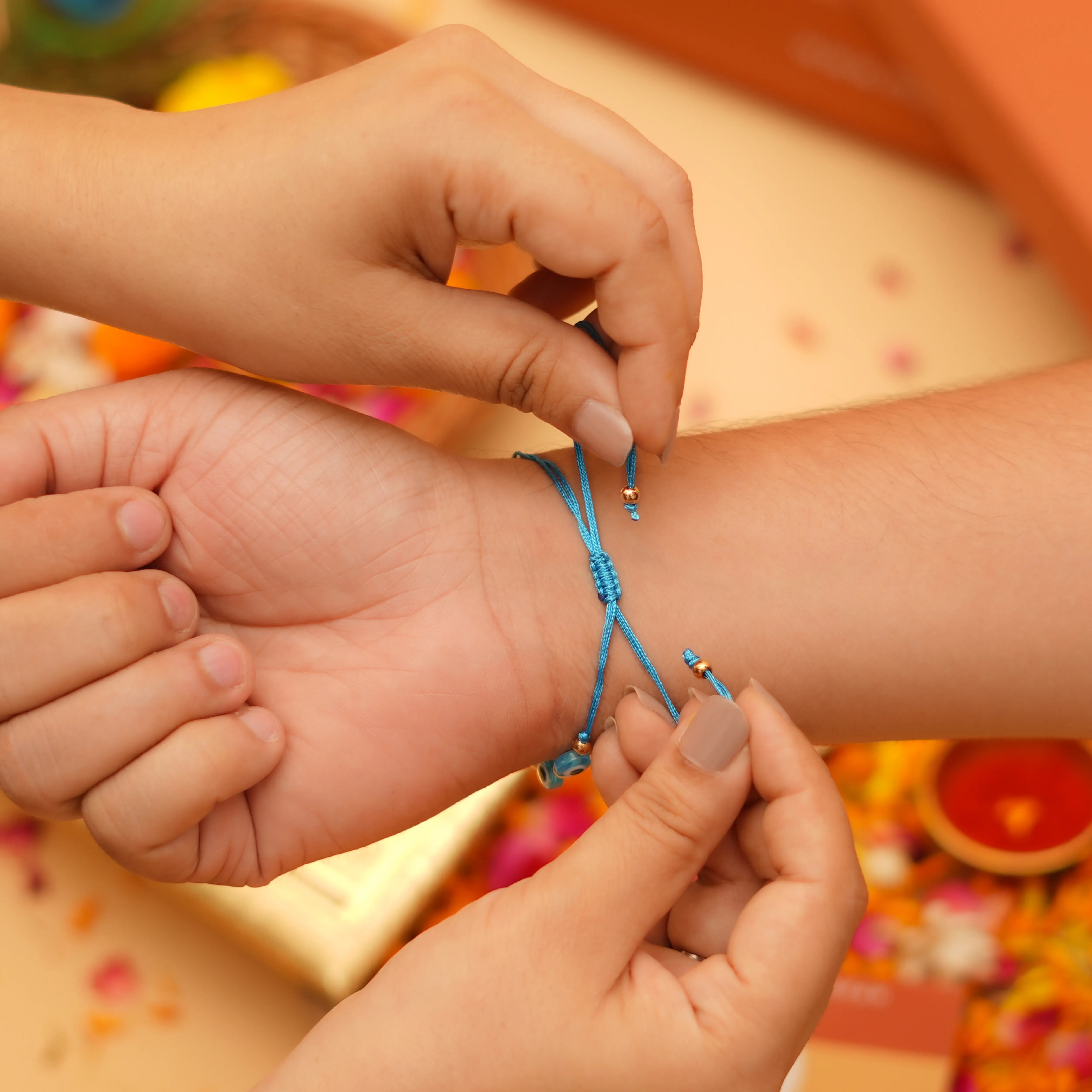 Handcrafted Drishti Kavach Studded Rakhi With Roli Chawal Thali