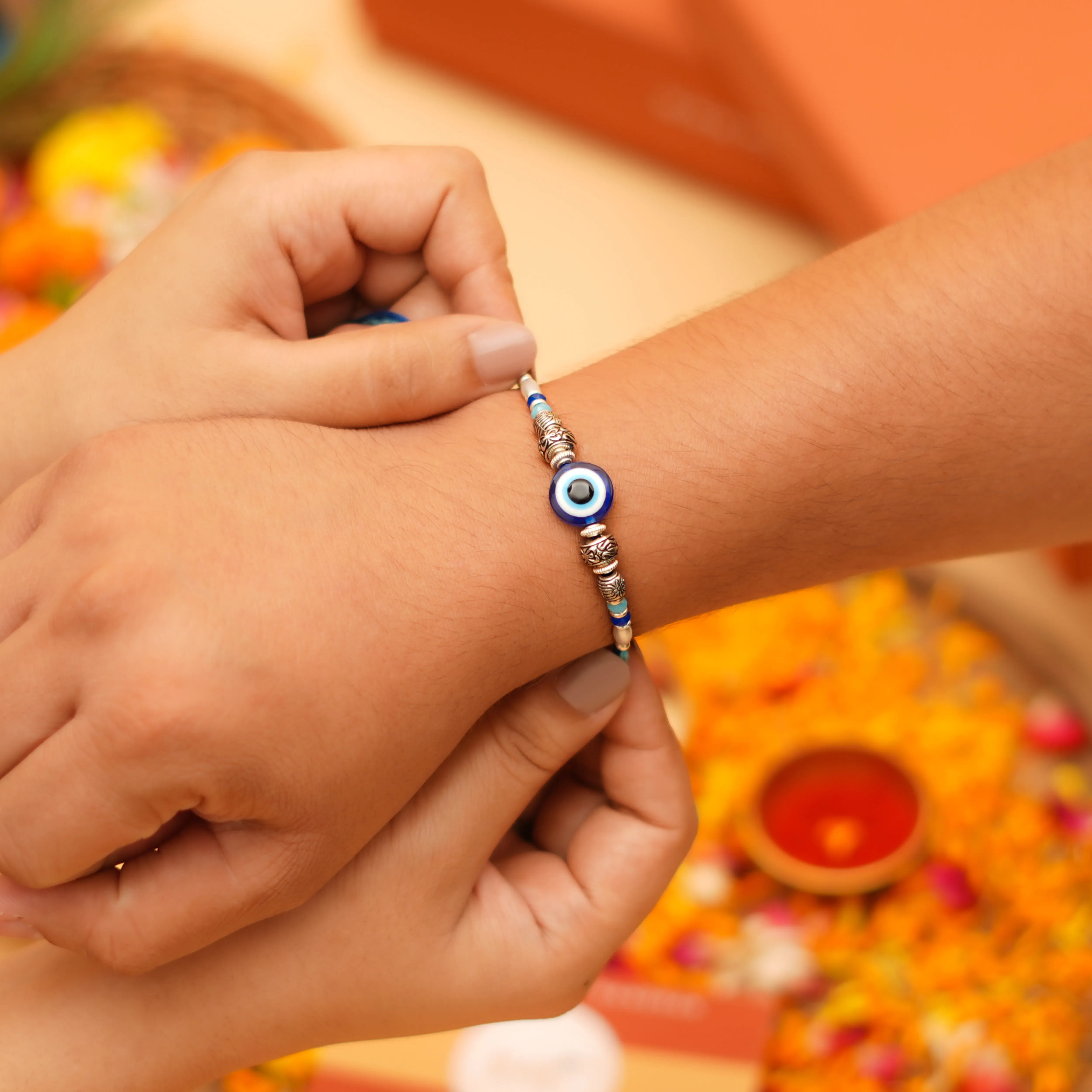 Handcrafted Blue Evil Eye & Metallic Beads Rakhi With Roli Chawal Thali