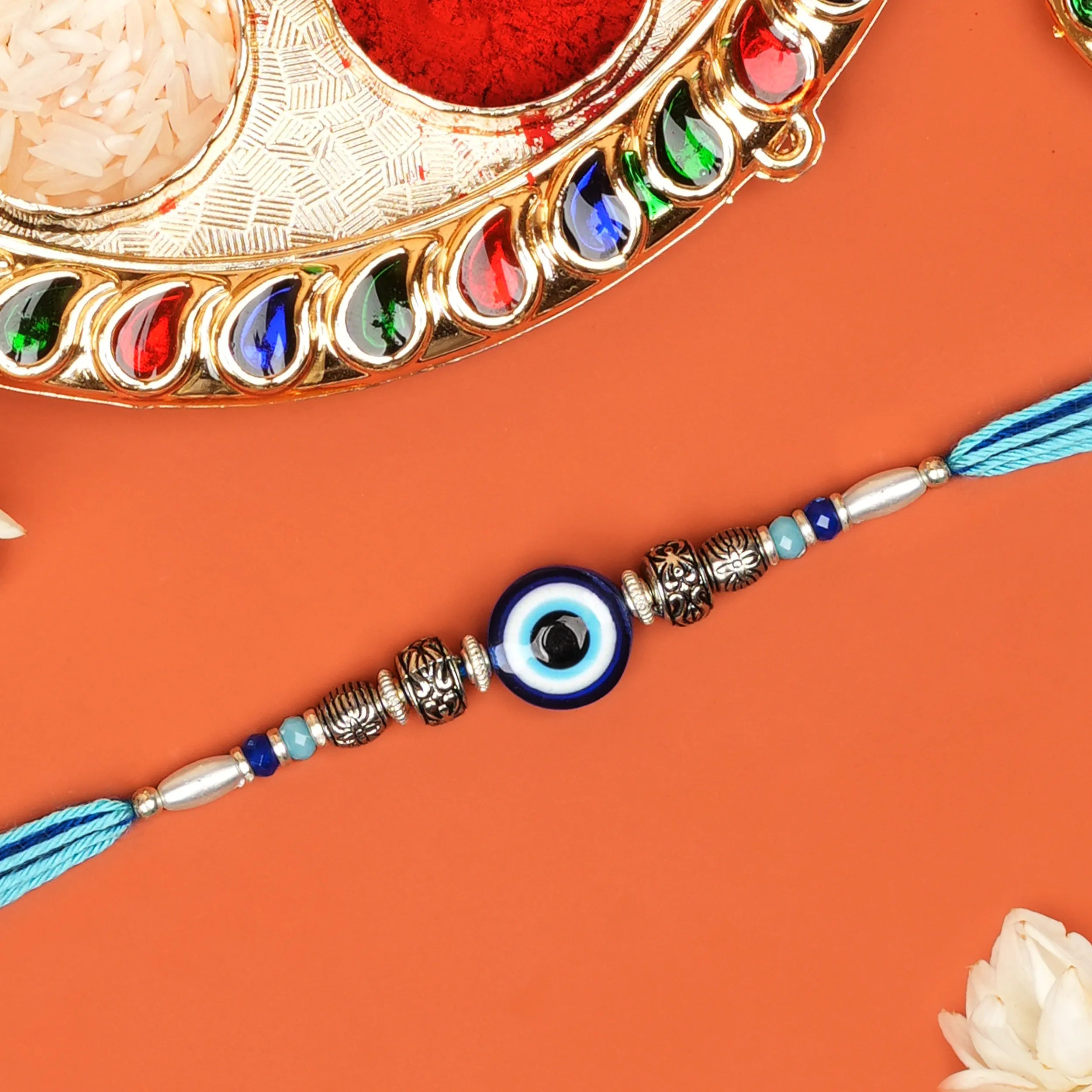 Handcrafted Blue Evil Eye & Metallic Beads Rakhi With Roli Chawal Thali