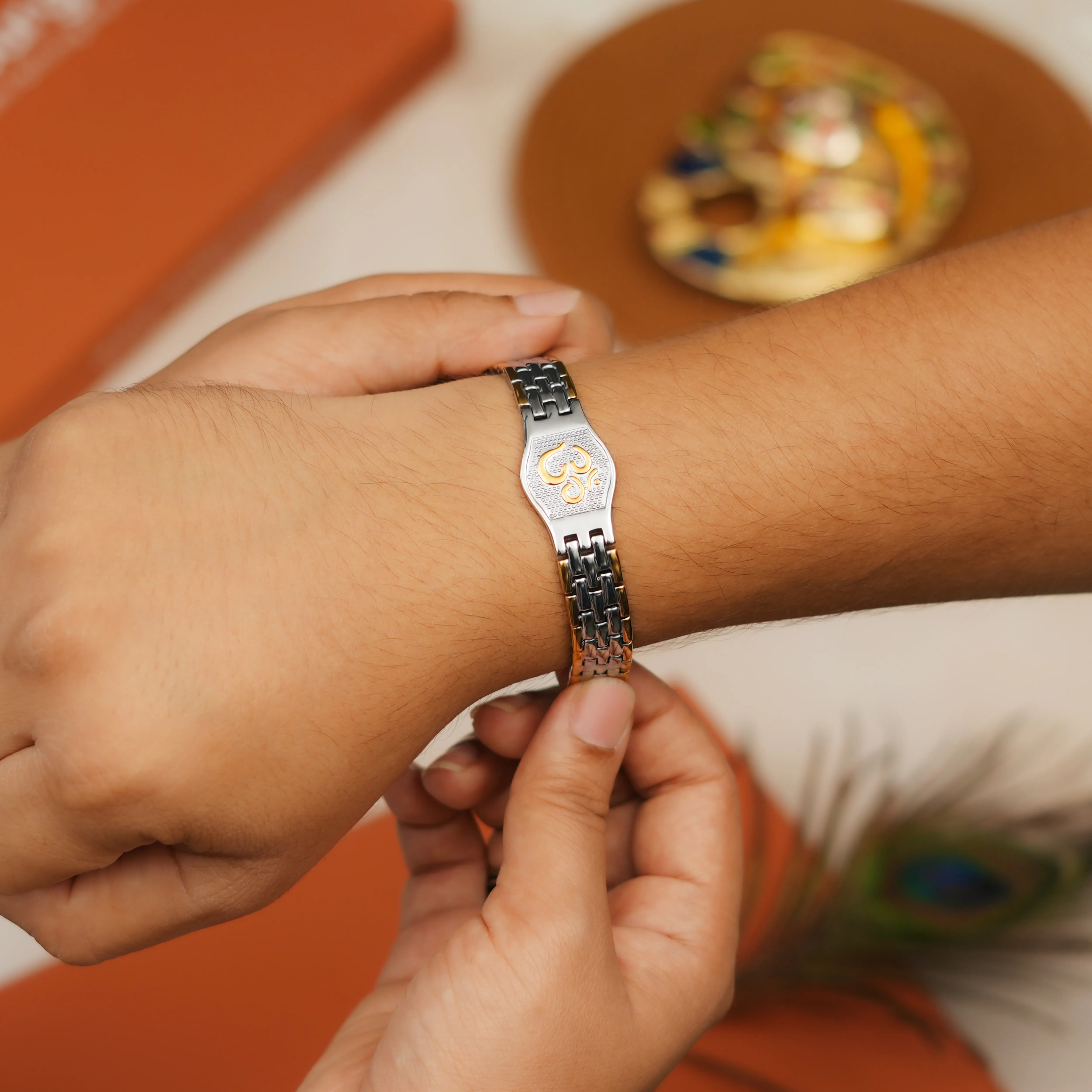 Om Engraved Dual-Color Bracelet Style Rakhi With Roli Chawal Thali